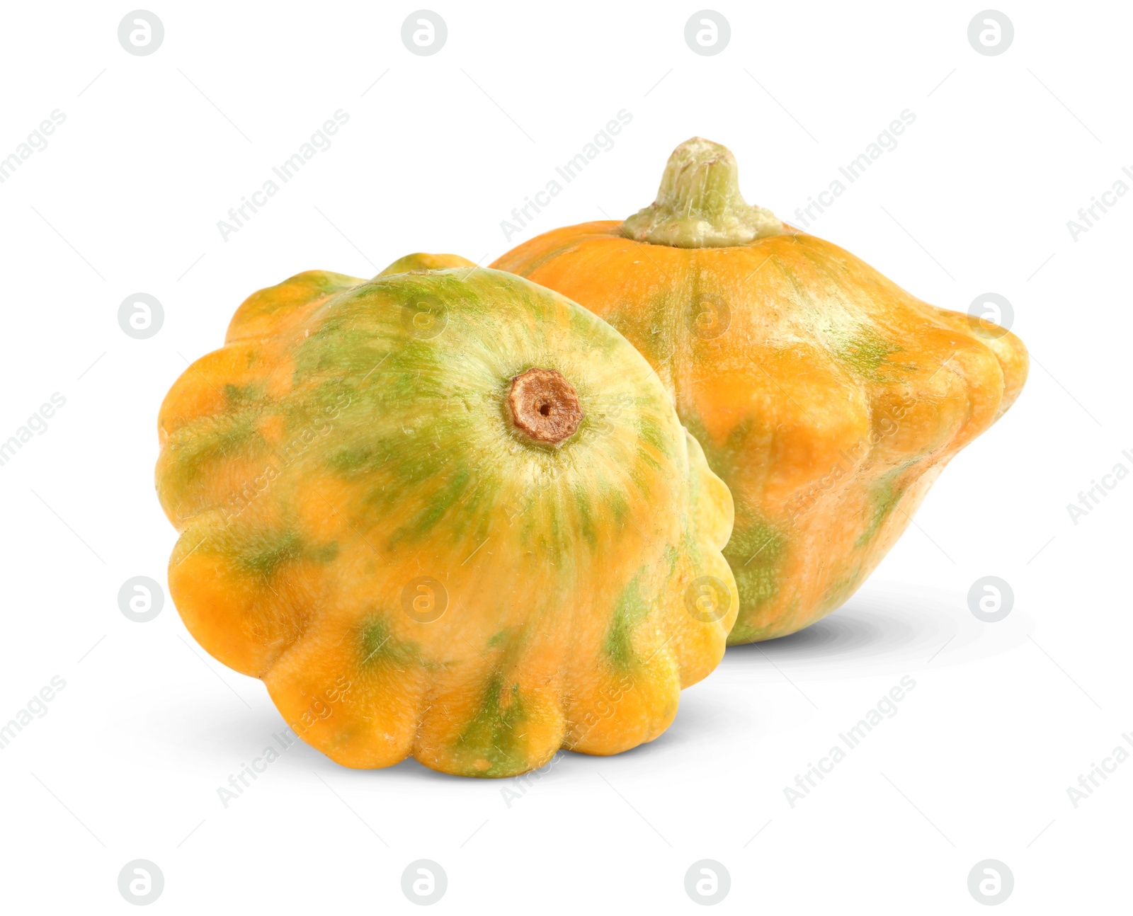 Image of Two fresh yellow pattypan squashes on white background