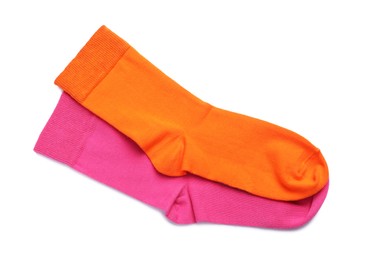 Photo of Different colorful socks on white background, top view