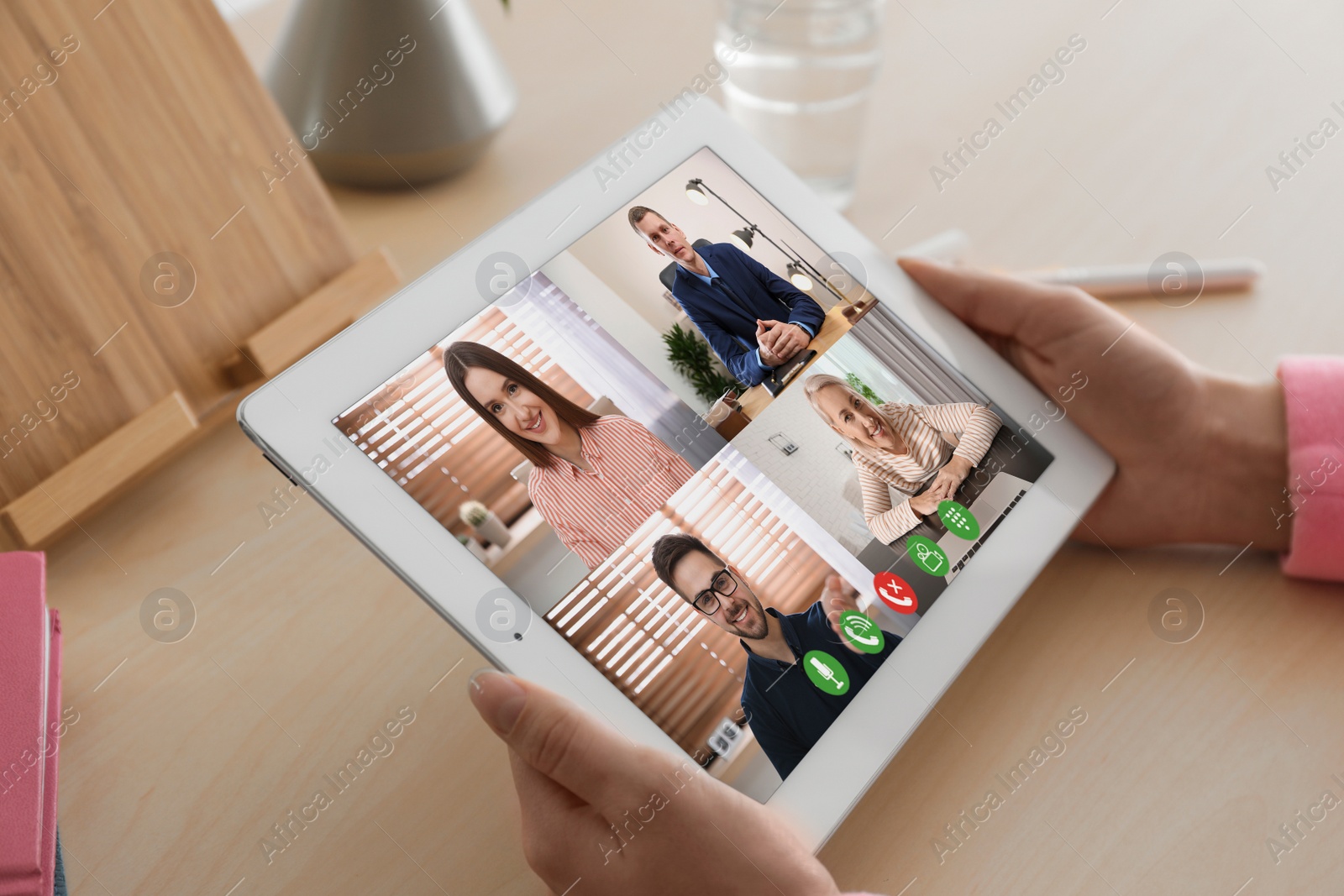 Image of Woman having video chat with colleagues at table in office, closeup. Team work 