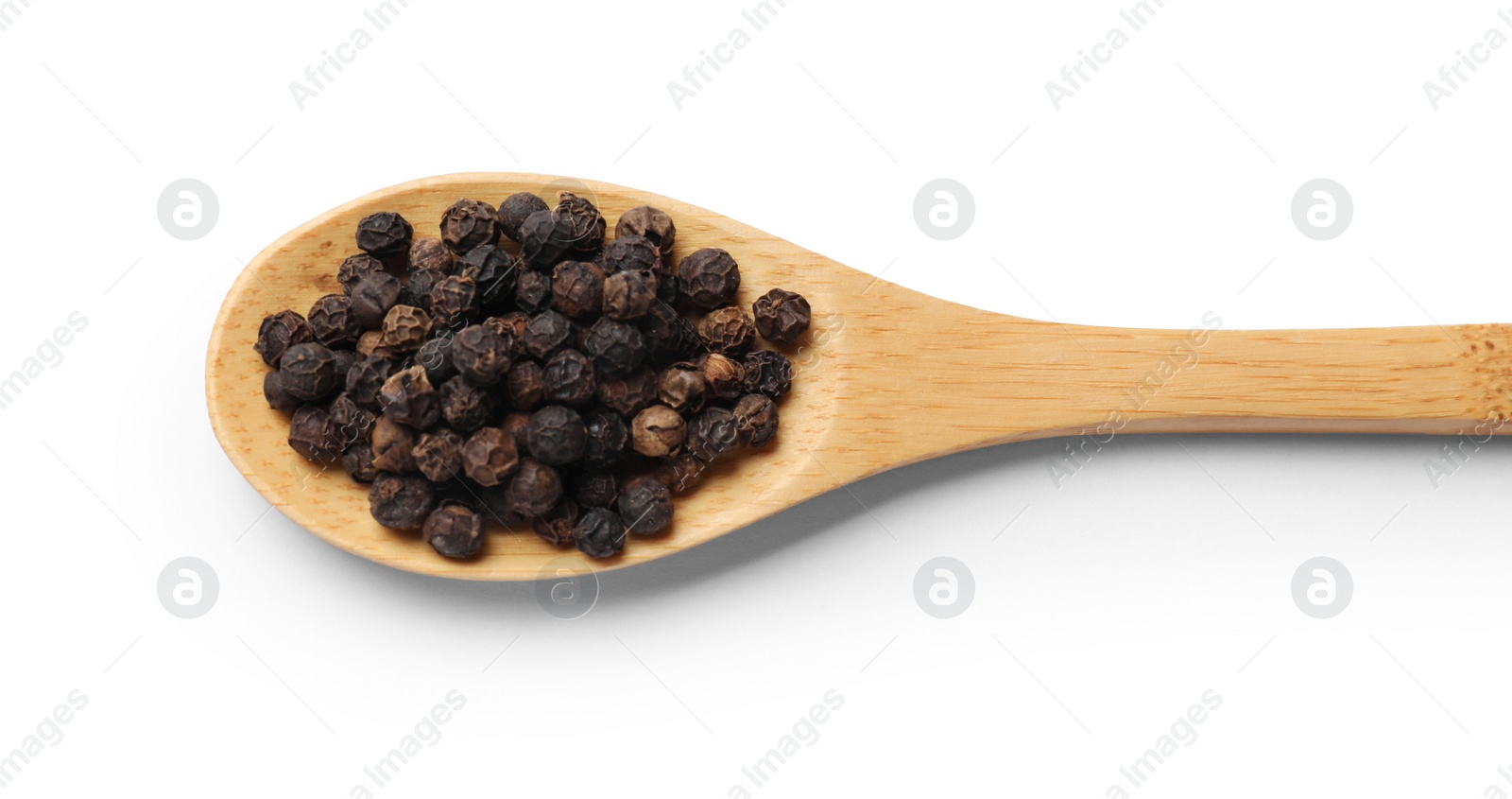 Photo of Aromatic spice. Many black peppercorns in spoon isolated on white, top view