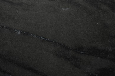 Photo of Black marble surface as background, closeup view