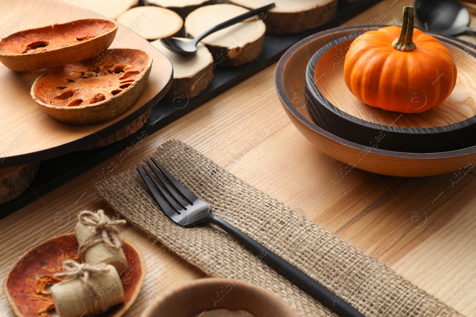 Photo of Autumn table setting with pumpkin on wooden background