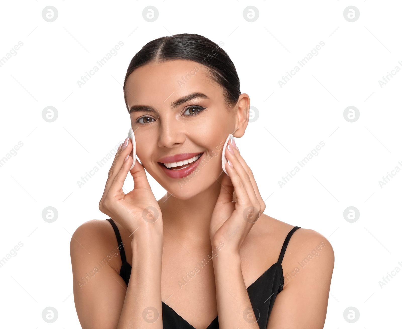 Photo of Beautiful woman removing makeup with cotton pads on white background