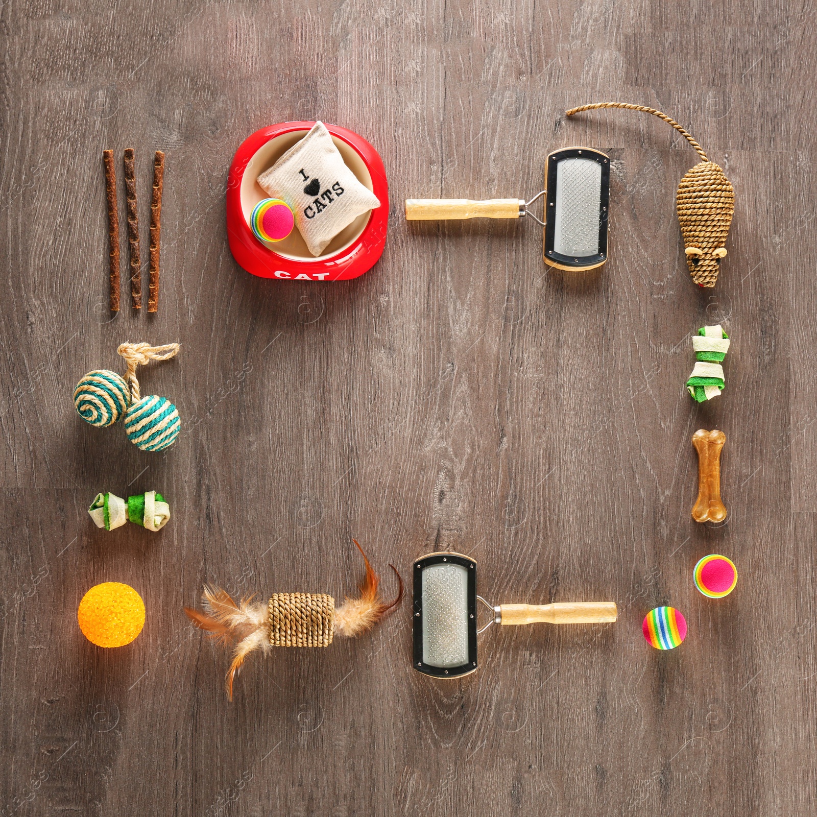 Photo of Flat lay composition with cat accessories on wooden background