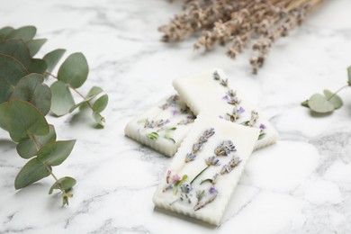 Composition with scented sachets on white marble table