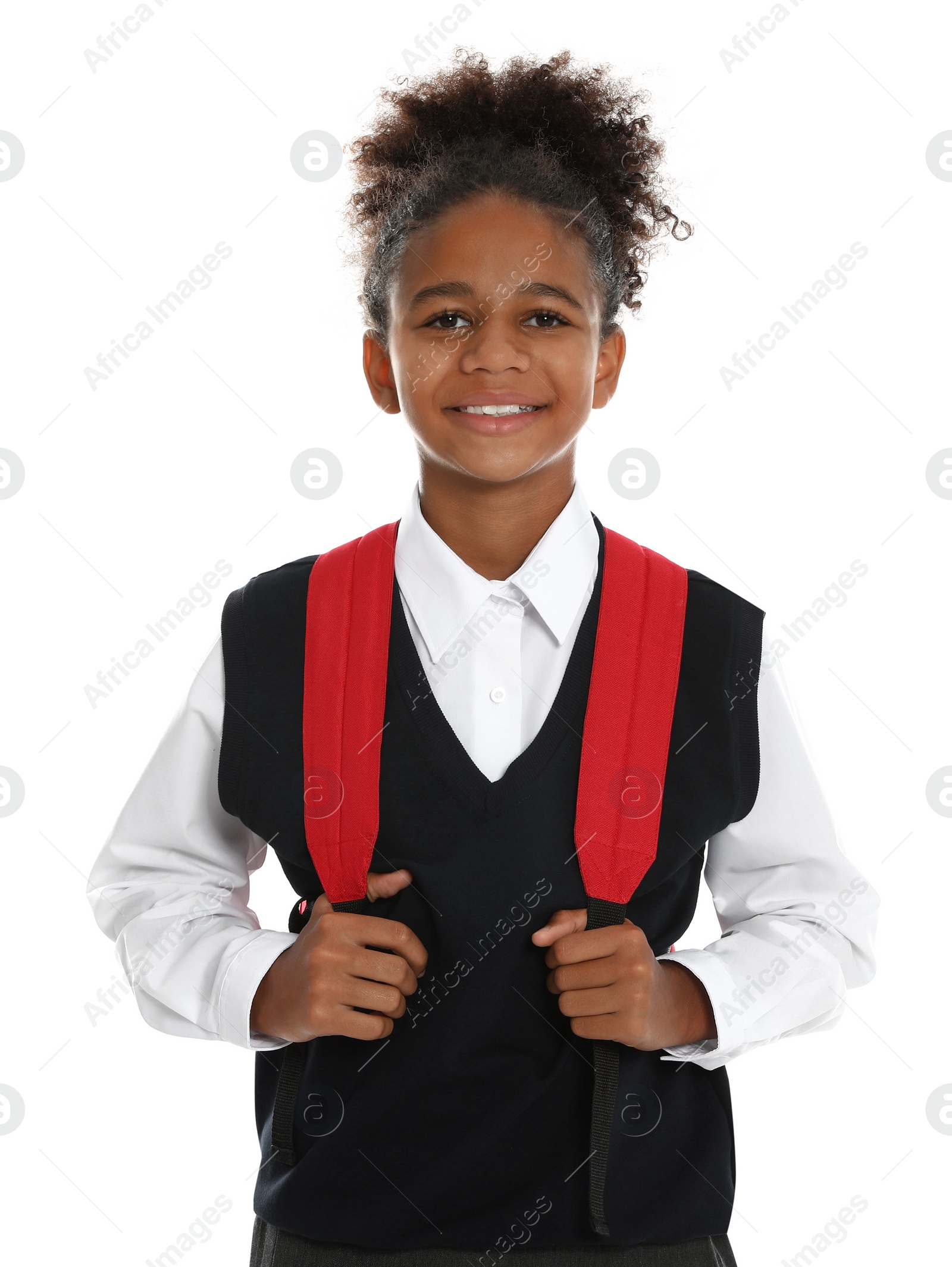 Photo of Happy African-American girl in school uniform on white background