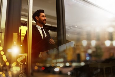 Double exposure of successful businessman and cityscape