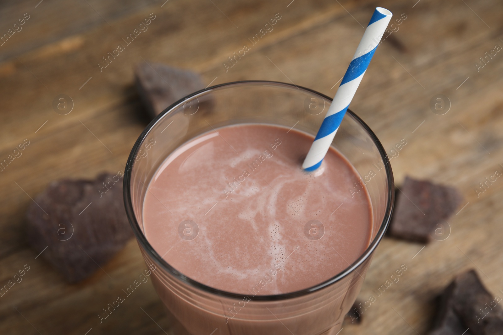 Photo of Delicious chocolate milk in glass, closeup view