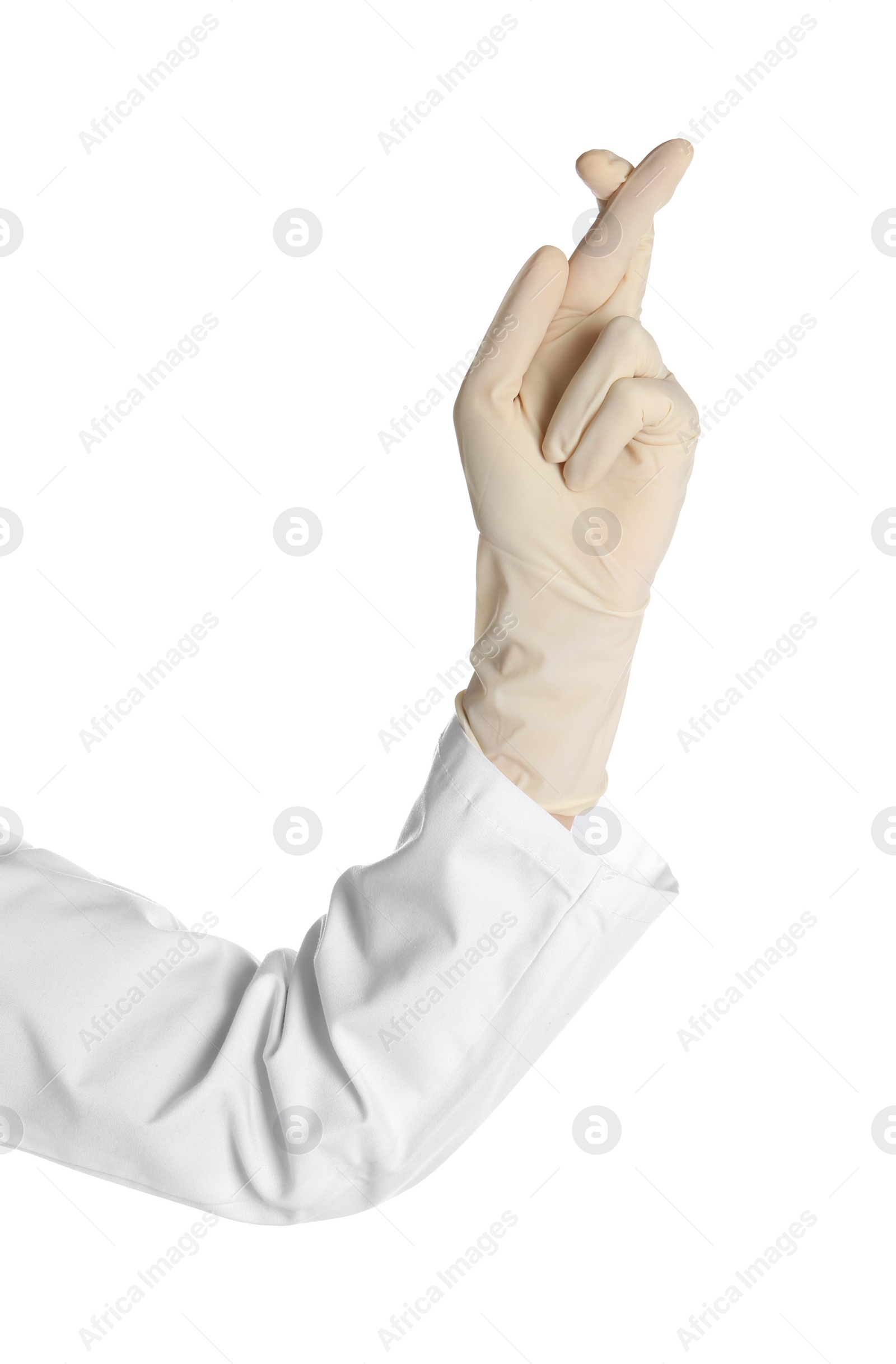 Photo of Doctor in medical glove keeping fingers crossed on white background