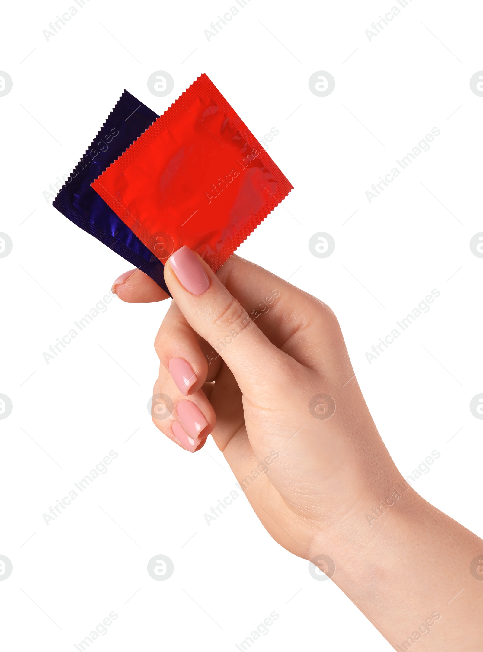 Photo of Woman holding condoms on white background, closeup