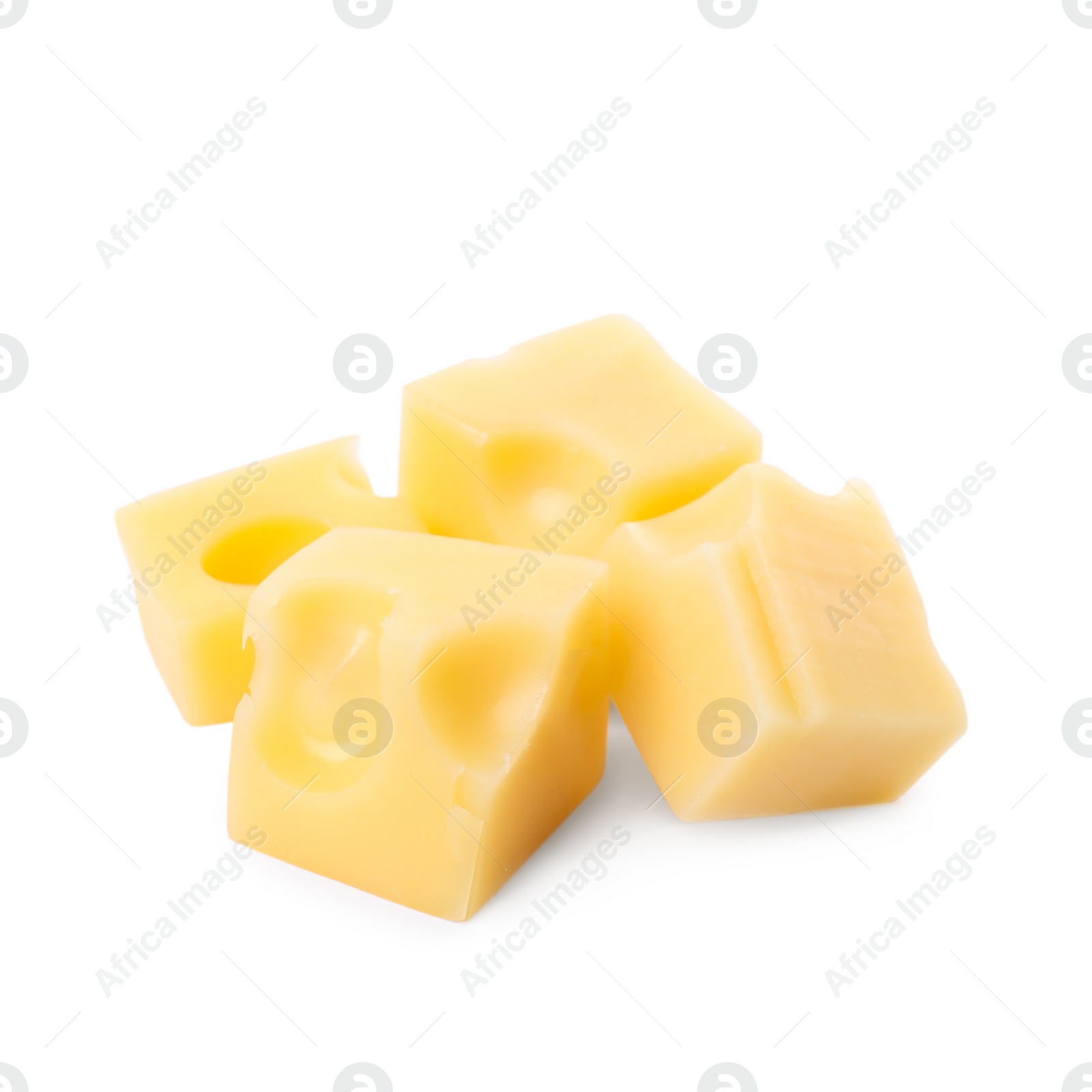 Photo of Cubes of delicious cheese isolated on white