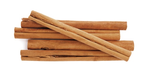 Photo of Aromatic dry cinnamon sticks on white background, top view