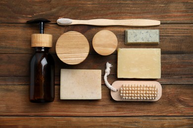 Photo of Eco friendly personal care products on wooden table, flat lay