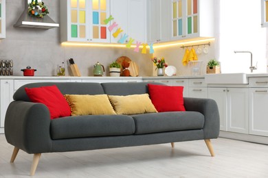 Photo of Beautiful room with Easter decor and comfortable furniture