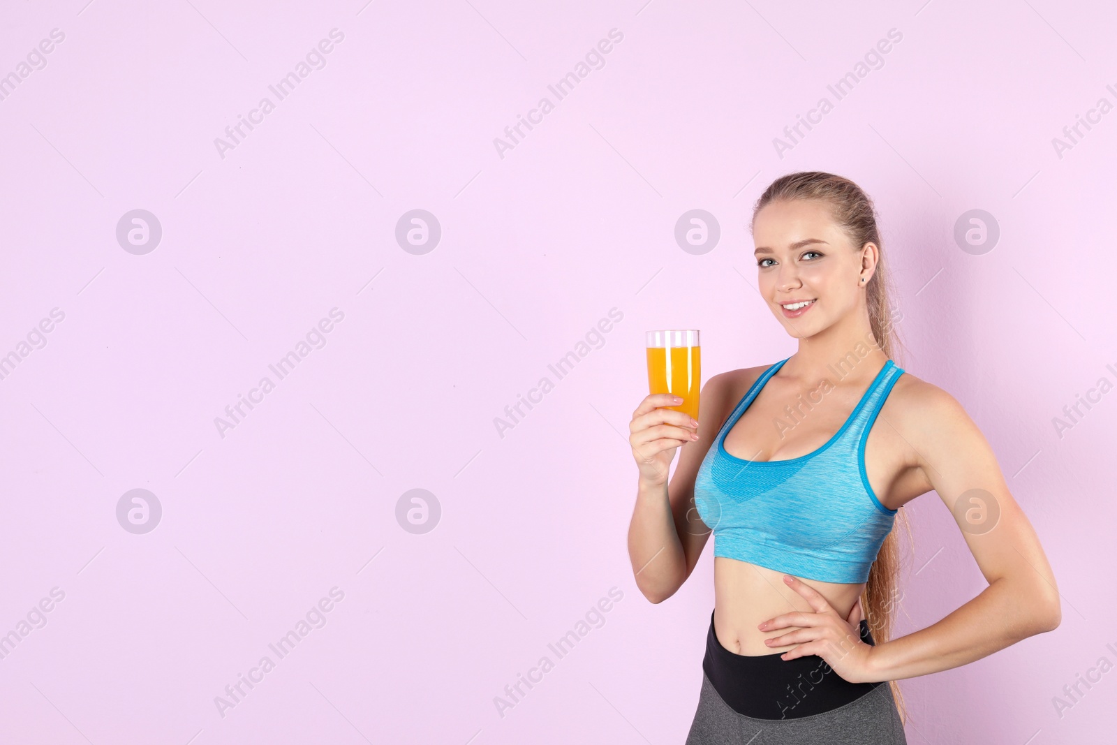 Photo of Young woman with glass of juice on color background. Healthy diet