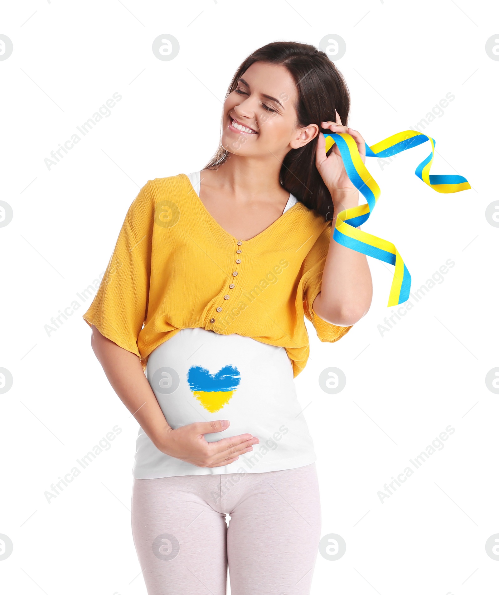 Image of Pregnant woman with heart painted on her belly and ribbon in colors of Ukrainian flag against white background. Stop war