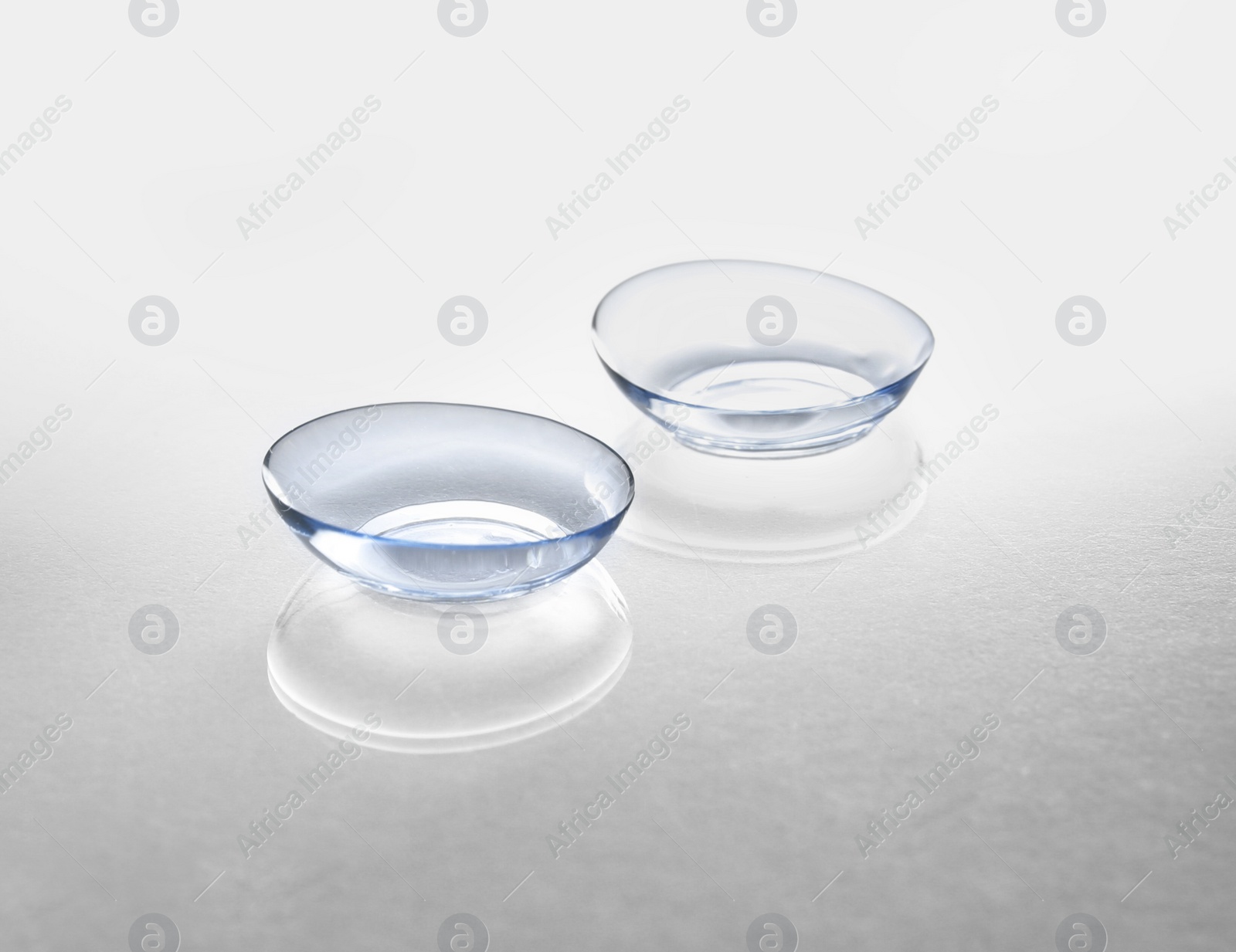 Photo of Contact lenses on light background
