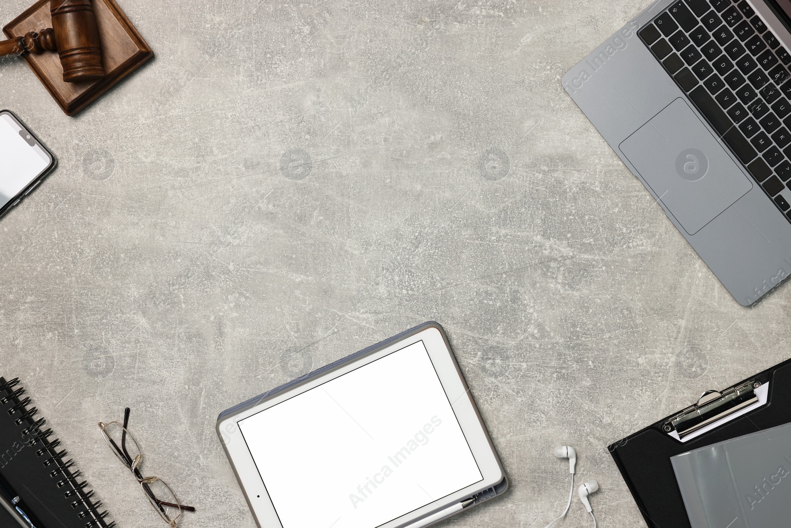 Photo of Flat lay composition with modern tablet on light gray textured table. Space for text