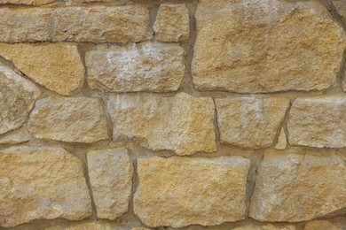 Photo of Texture of pale orange brick wall as background