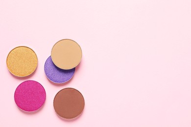 Photo of Different beautiful eye shadows on beige background, flat lay. Space for text