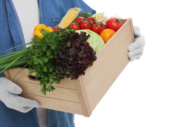 Harvesting season. Farmer holding wooden crate with vegetables on white background, closeup