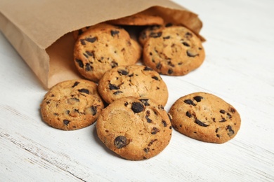 Delicious chocolate chip cookies on wooden table