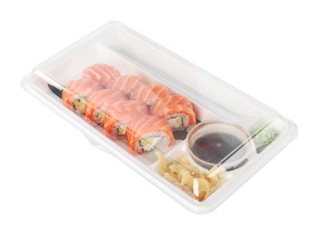 Photo of Food delivery. Delicious sushi rolls with soy sauce, ginger, wasabi and chopsticks in plastic container isolated on white