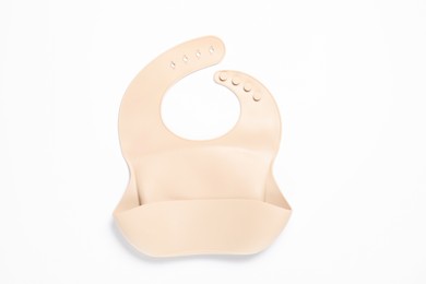 Photo of Light pink silicone baby bib isolated on white, top view