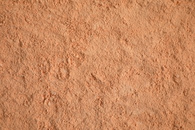 Loose face powder as background, top view