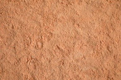 Photo of Loose face powder as background, top view