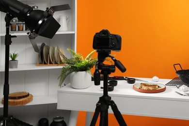 Professional equipment and composition with delicious meat medallion on white table in studio. Food photography