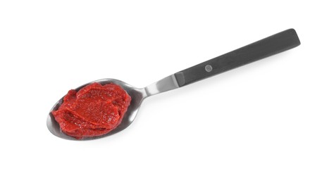 Spoon of tasty tomato paste isolated on white, top view