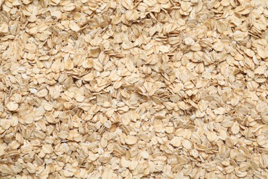 Photo of Top view of rolled oats as background