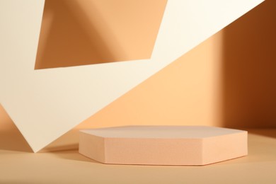 Photo of Presentation of product. Podium and paper on orange background