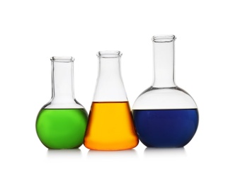 Photo of Chemistry glassware with color samples isolated on white