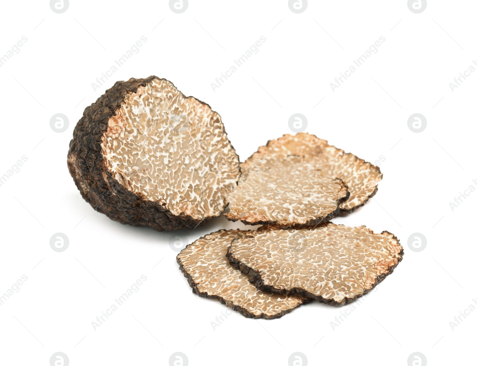 Photo of Cut fresh black truffle isolated on white