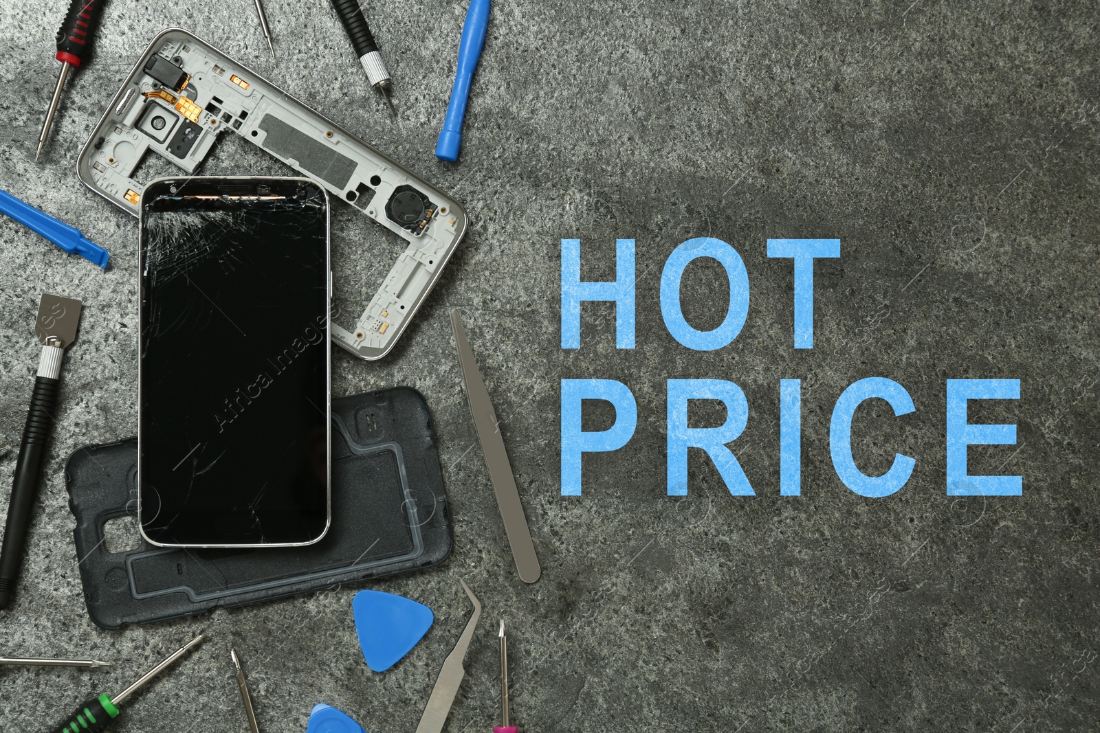 Image of Smartphone repairing by hot price. Damaged mobile phone and tool set on grey table, flat lay