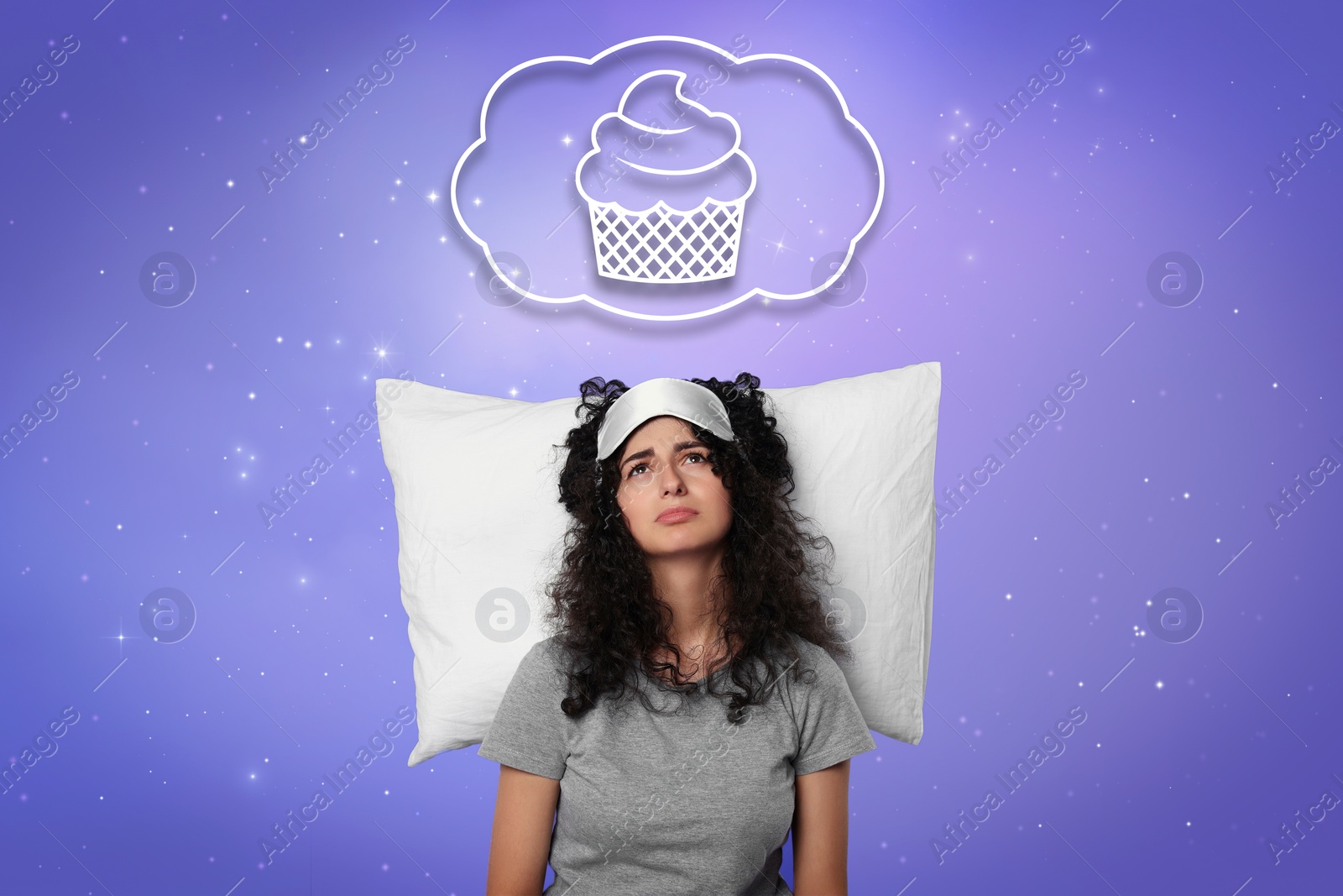 Image of Insomnia. Woman can`t fall asleep because of hunger against starry night sky. Thought cloud with illustration of cupcake above her