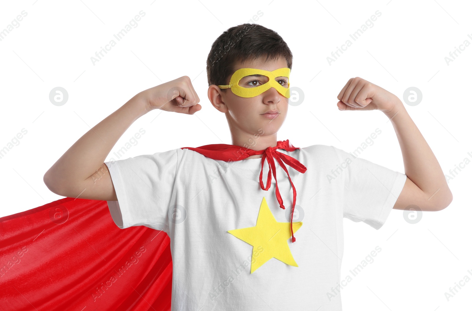 Photo of Teenage boy in superhero costume on white background