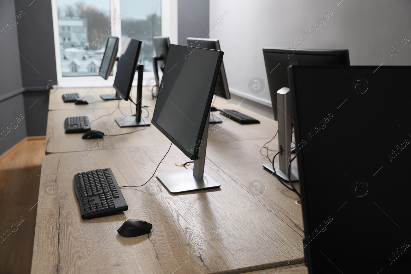 Photo of Many modern computers in open space office