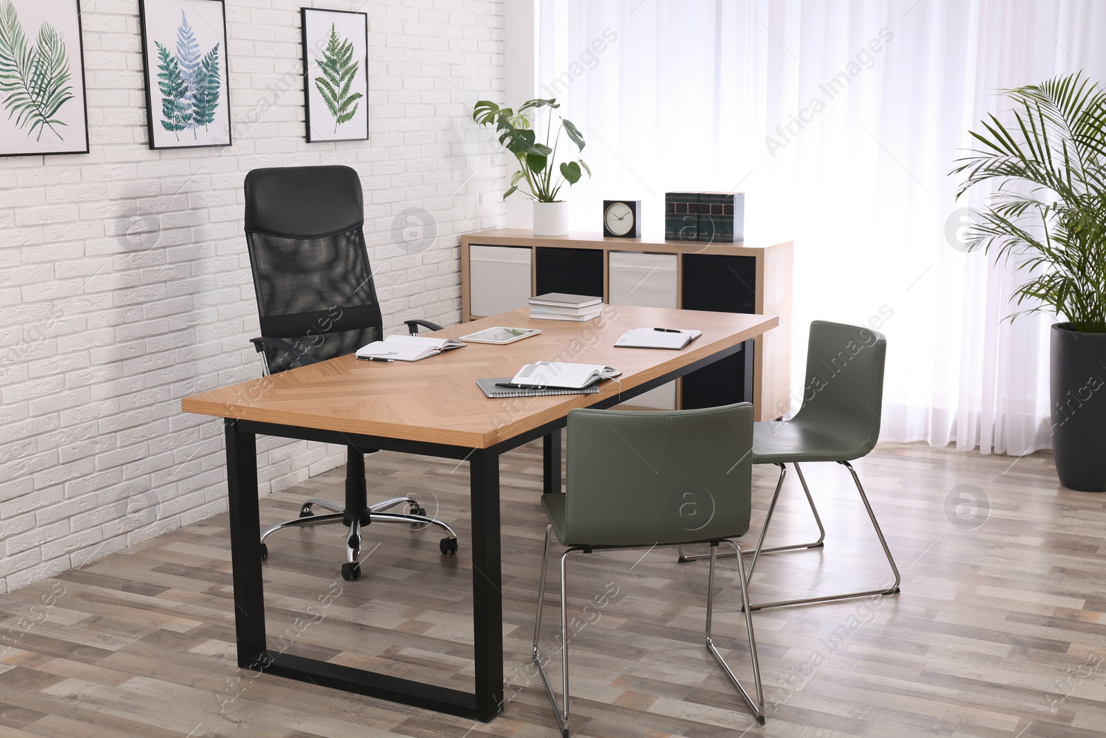 Photo of Director's office with large wooden table. Interior design