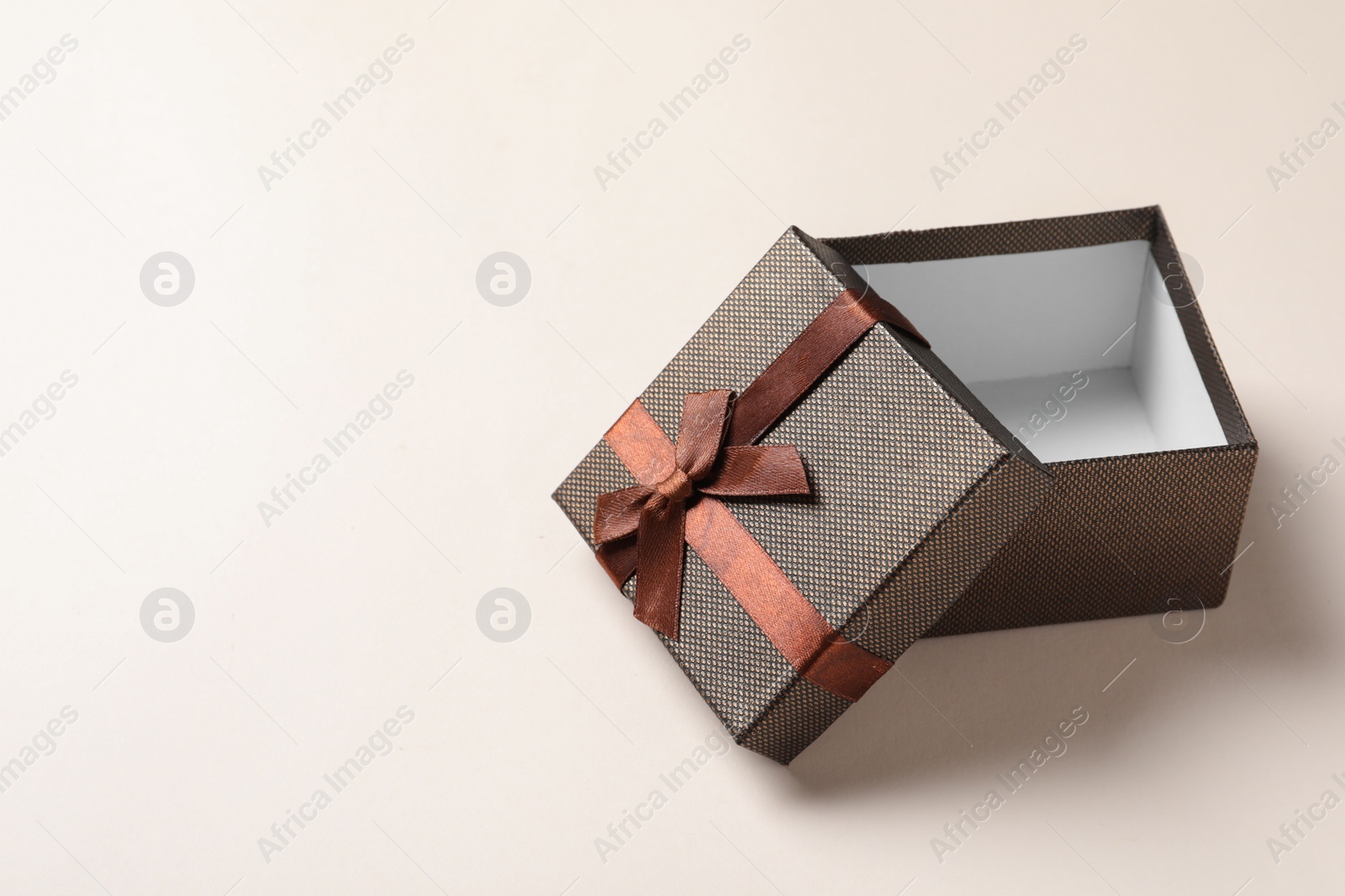 Photo of Empty open gift box on light background