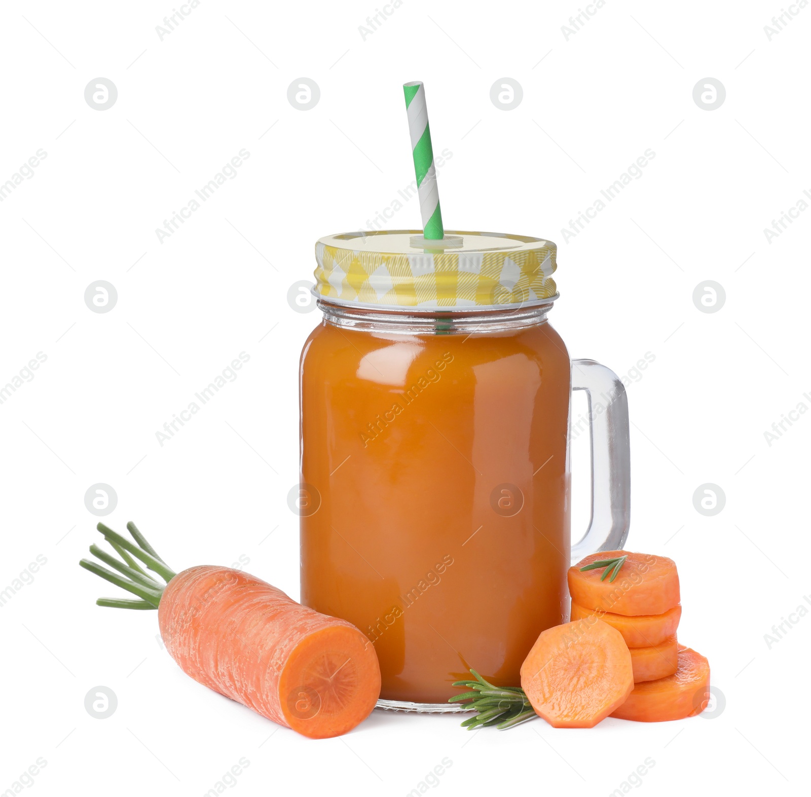 Photo of Freshly made carrot juice in mason jar on white background