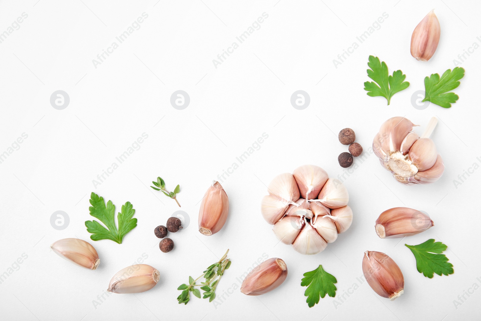 Photo of Flat lay composition with garlic on light background