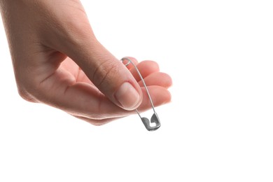 Photo of Woman holding safety pin on white background, closeup