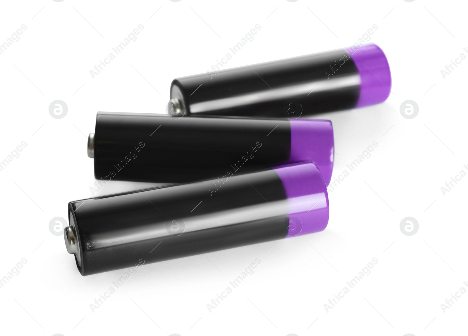 Image of Many new AA batteries on white background