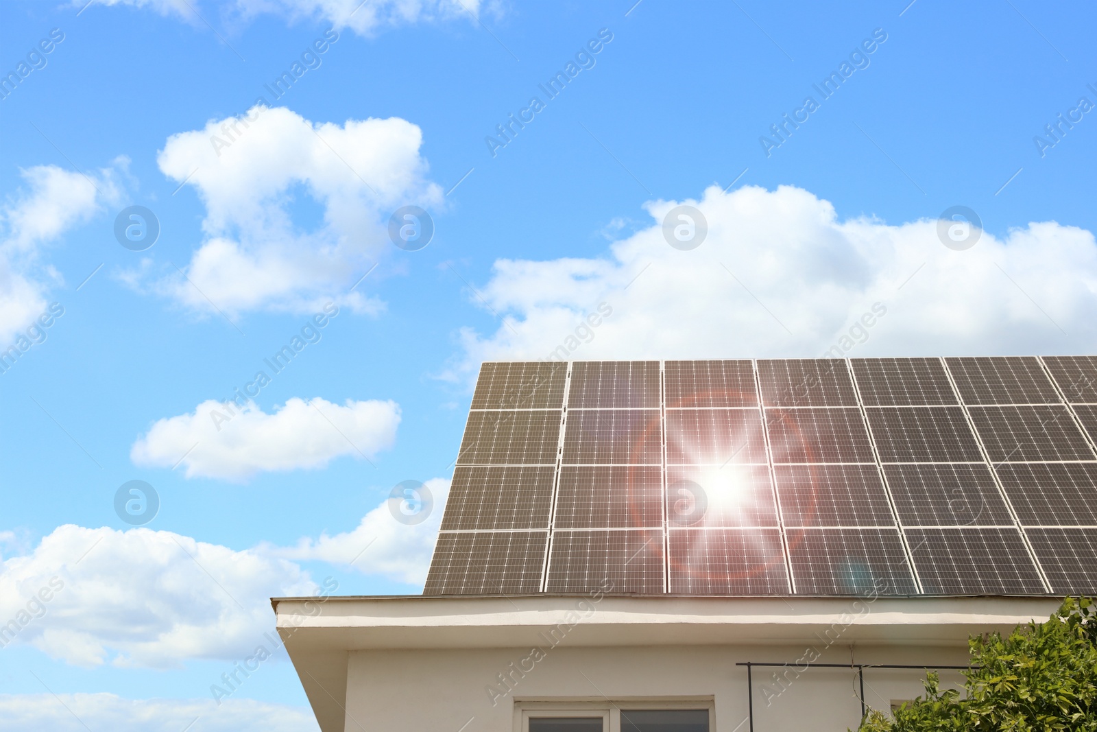 Photo of Building with installed solar panels on roof. Alternative energy source