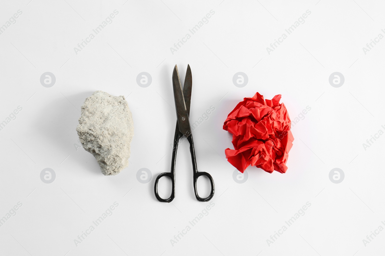 Photo of Rock, paper and scissors on white background, top view