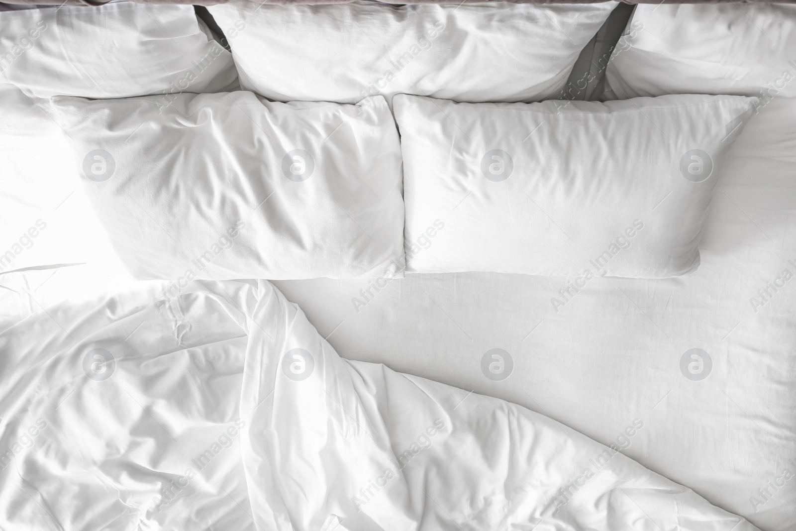 Photo of Comfortable bed with white linen at home