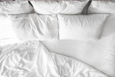 Photo of Comfortable bed with white linen at home